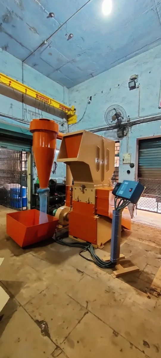 RE25CB grinder with cyclone blower grinding PET preforms into flake with pneumatic bag discharge, Raj Electricals, Mumbai